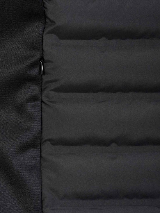 Detail van de zijkant van een zwarte, gewatteerde bodywarmer voor dames van Bjørnson met rits.