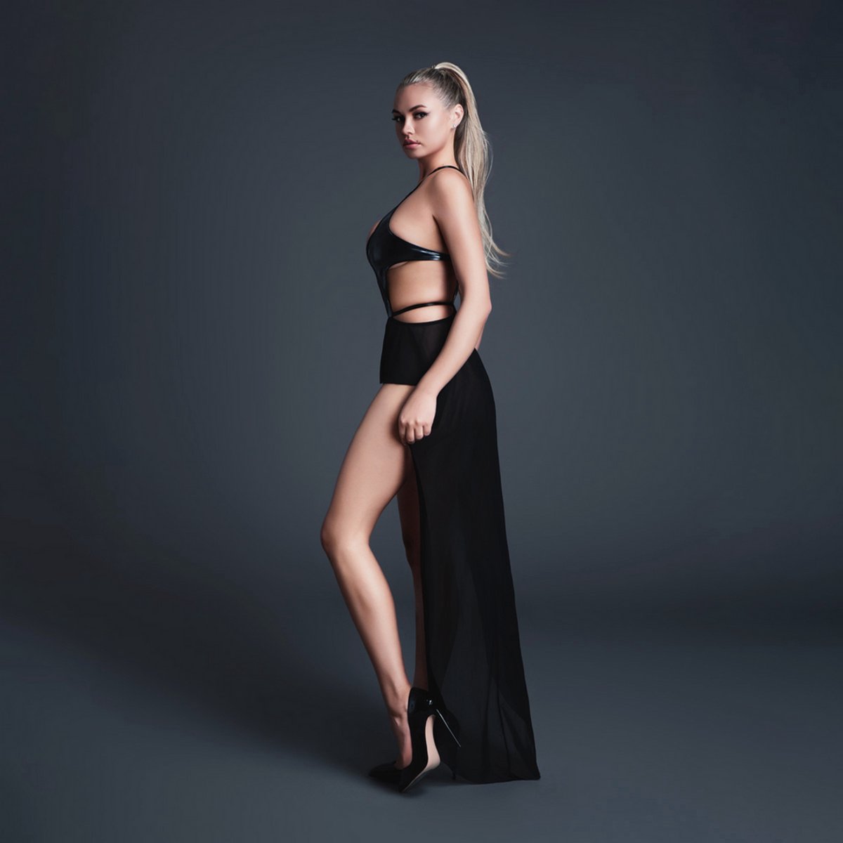 Allure Sexy Take Me - Latex-look Vinyl en Mesh Bodysuit met Flirty Rok - Zwart - Maat L