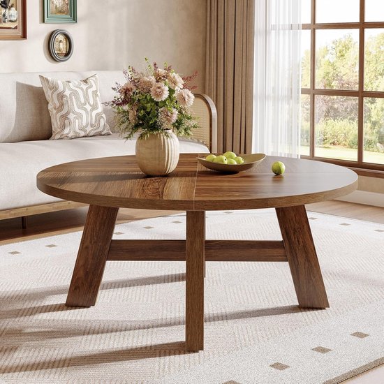 Ronde salontafel met walnoothouten afwerking, vierkante patronen en decoratieve bloemen.