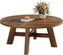 Ronde salontafel met warme walnootkleur, vier poten met horizontale steunen en een vaas met bloemen.
