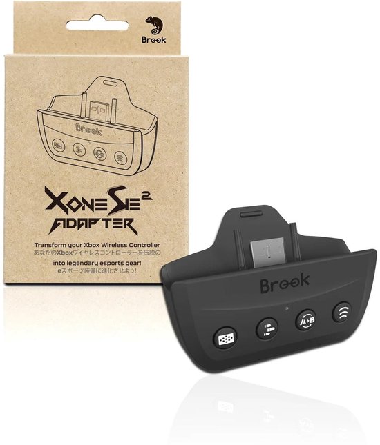 Zwarte Brook adapter met icoontjes voor touchpad, turbo, remapping en button hold. Naast de kartonnen verpakking.
