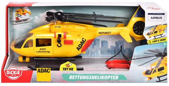 Gele reddingshelikopter van Dickie Toys in verpakking, met "ADAC Luftrettung" en rode brancard.