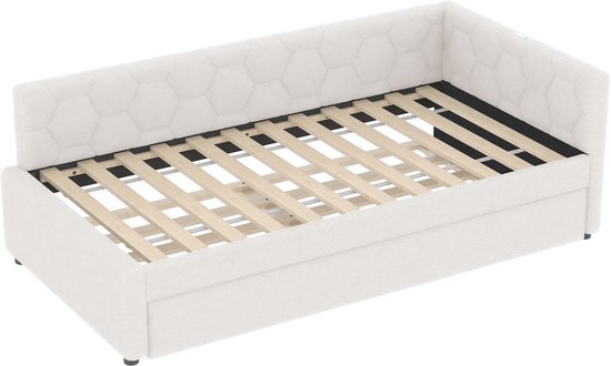 Wit slaapbank frame met zeshoekig gestoffeerde rugleuning.
