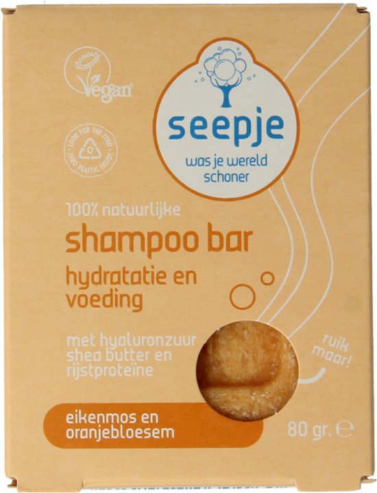 Kartonnen verpakking van Seepje shampoo bar, geel met tekst en afbeeldingen. Bevat een stuk zeep.