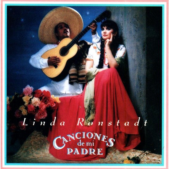 Linda Ronstadt met een man in traditionele Mexicaanse kledij, met een sombrero en gitaar. De albumtitel 'Canciones de mi Padre' is zichtbaar.