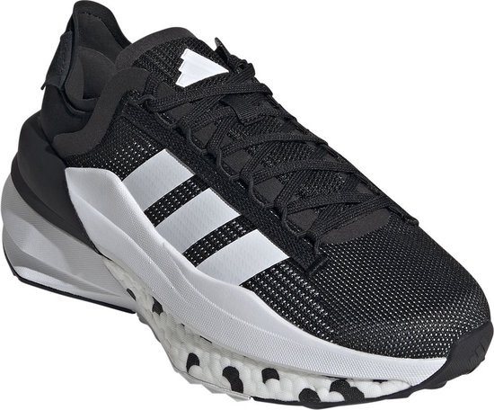 Baskets noires pour femme avec bandes blanches Adidas, semelle blanche et accents blancs.