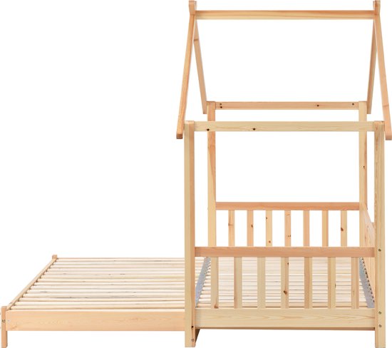 Zijaanzicht van een huisbedframe van natuurlijk massief hout, met uitschuifbare bodem.