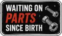 Rechthoekige sticker met tekst 'Waiting on parts since birth' en illustraties van twee bouten.