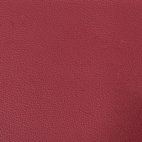 Close-up textuur van wijnrood kunstleer met een korrelige afwerking.