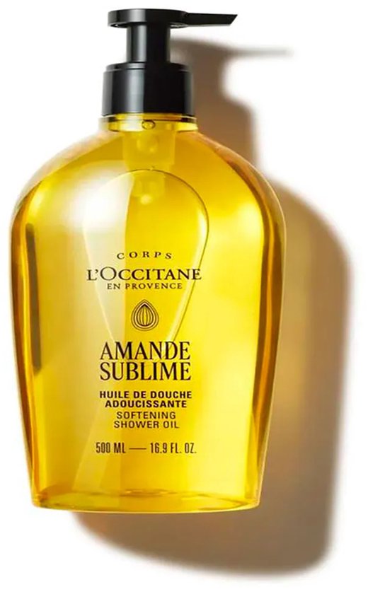 L'Occitane Amande Sublime verzachtende doucheolie in een doorzichtige gele fles met zwarte pompdispenser. 500 ml.