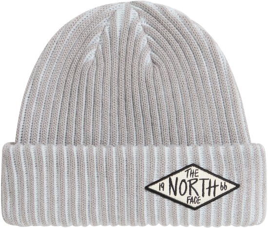 Grijze, geribbelde muts met omgeslagen rand en een opgestikte The North Face-patch in ruitvorm.