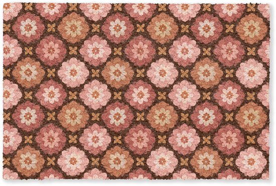 Rechthoekige deurmat met een patroon van roze en perzikkleurige bloemen op een bruine ondergrond.