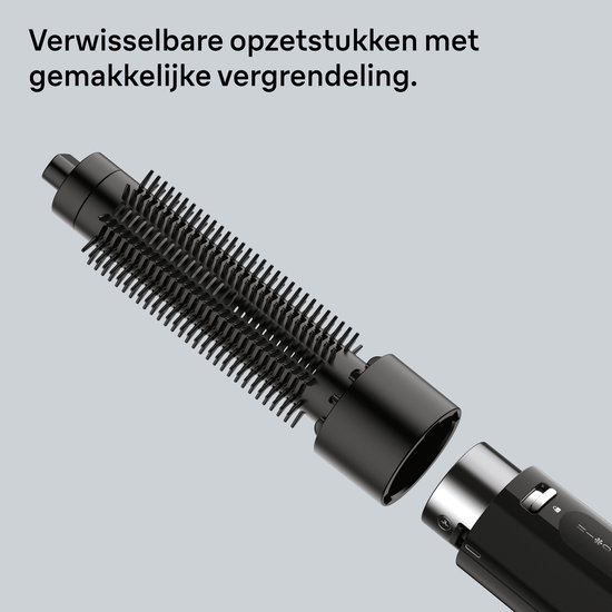 Close-up van de zwarte stijltangborstel met afneembare opzetstukken en gemakkelijke vergrendeling.