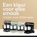 Zwarte, groene en crème keukenmachines naast elkaar. "Een kleur voor elke smaak".