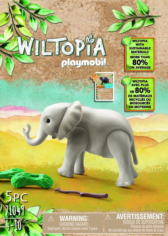 Grijze Playmobil babyolifant met tak en groen struikgewas op een speelgoedverpakking.
