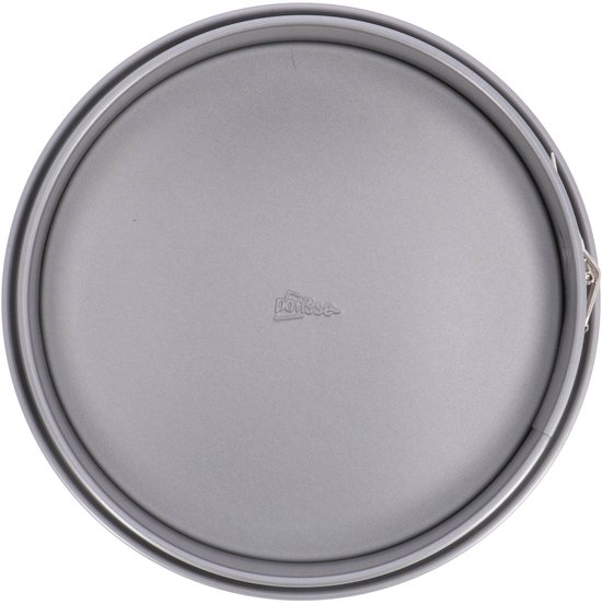Een ronde, zilverkleurige springvorm, van bovenaf gefotografeerd.