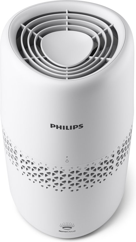 Humidificateur d'air Philips blanc avec ouverture sur le dessus et motif décoratif sur le côté.