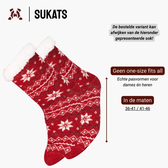 Een paar rode kerstsokken met wit patroon, witte fleece voering.