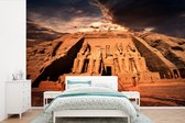 Behang - Fotobehang Wolken boven de Tempel van Aboe Simbel in Egypte - Breedte 390 cm x hoogte 260 cm