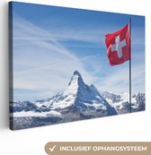 Canvas Schilderij Zwitserse Vlag bij Matterhorn in Zwitserland - 90x60 cm - Wanddecoratie