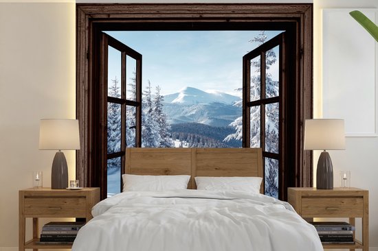 Behang - Fotobehang Winter - Landschap - Natuur - Berg - Bomen - Doorkijk - Uitzicht - Breedte 350 cm x hoogte 350 cm