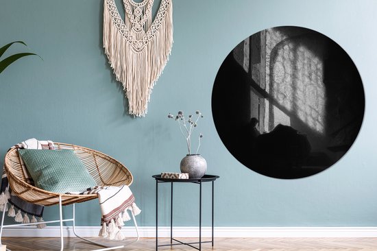 Un homme lisant dans une chambre haute - Peinture de Rembrandt van Rijn Plaque en plastique de cercle mural