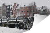 Tuinposters buiten Amsterdam - Fiets - Winter - 90x60 cm - Tuindoek - Buitenposter