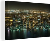 Canvas Schilderij Luchtfoto van het Amerikaanse Jersey City in de nacht - 90x60 cm - Wanddecoratie