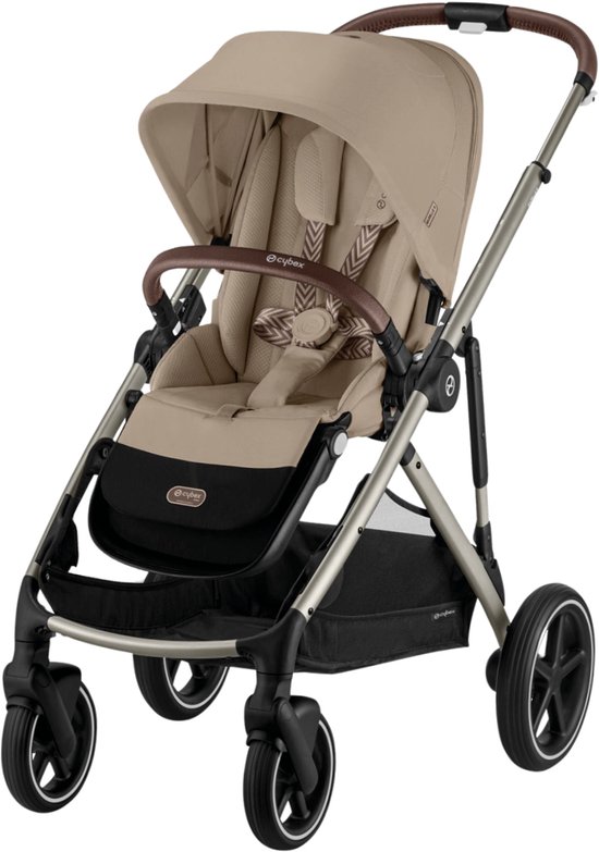 Beige kinderwagen met taupe frame, bruine handgrepen, beige zitting en een grafisch motief op de gordels.