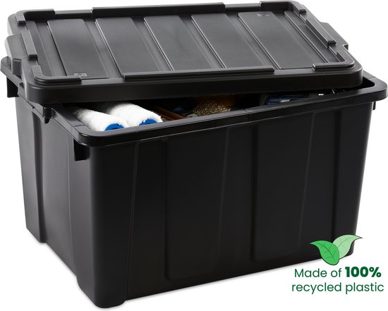 Zwarte opbergbox met open deksel, gevuld met opgerolde witte handdoeken.