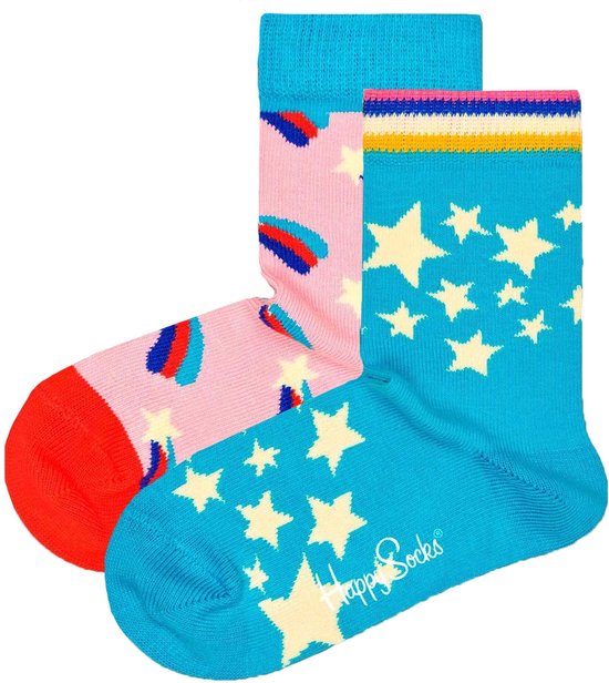 Twee paar Happy Socks kindersokken. Een roze paar met sterren en vallende sterren, en een blauw paar met sterren en de tekst 'Happy Socks'.