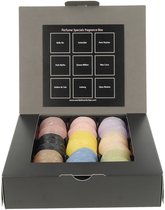 Een geopende geschenkdoos met 9 Scentchips in verschillende kleuren, waaronder roze, geel, paars en blauw. De doos heeft een label met productnamen.
