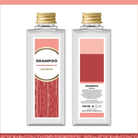 Transparant roze flesje shampoo bamboe met gouden dop. Op het etiket bamboe-afbeeldingen.