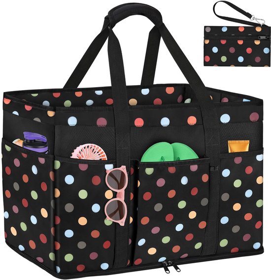Zwarte strandtas met veelkleurige polkadots, diverse buitenvakjes met slippers en zonnebril, en een ingebouwd vakje.