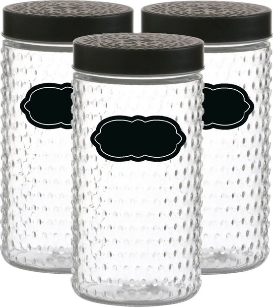Trois bocaux de stockage en verre avec couvercles noirs à motifs et surface texturée, chacun avec une étiquette noire.