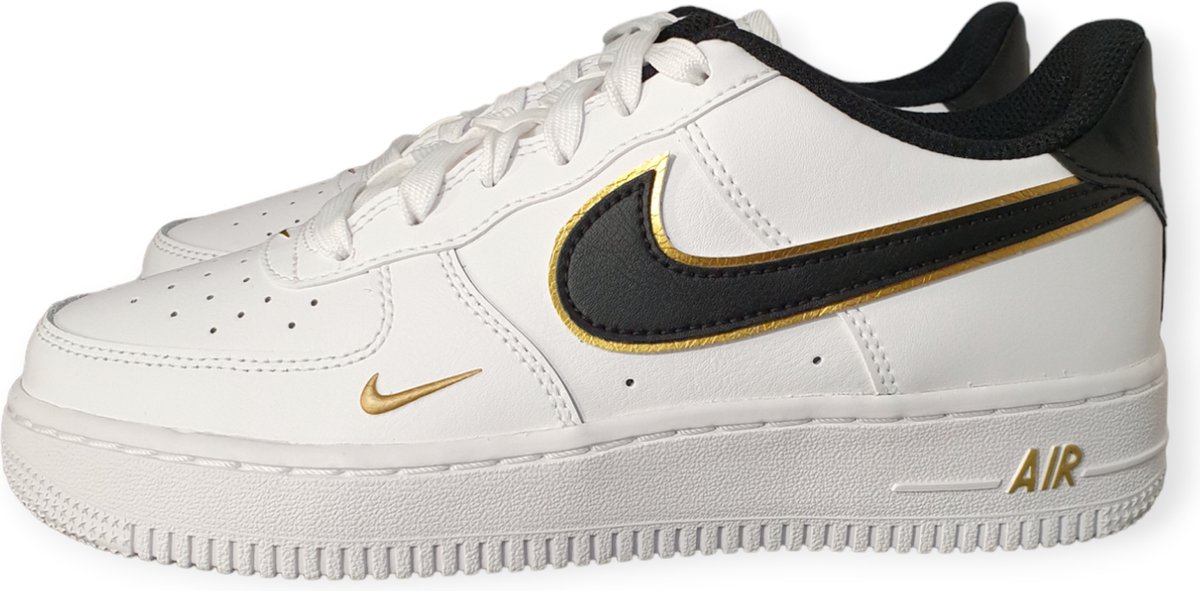 gold and white nike sneakers