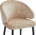 Gros plan d'un fauteuil beige clair sur pieds noirs.