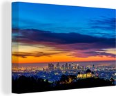 Canvas Schilderij Skyline van Los Angeles met Griffith Park bij zonsondergang - 90x60 cm - Wanddecoratie