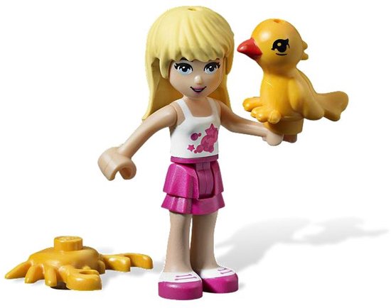 Blond LEGO Friends poppetje met roze rok, wit shirt met sterren, houdt geel kuikentje vast. Gele krab ernaast.