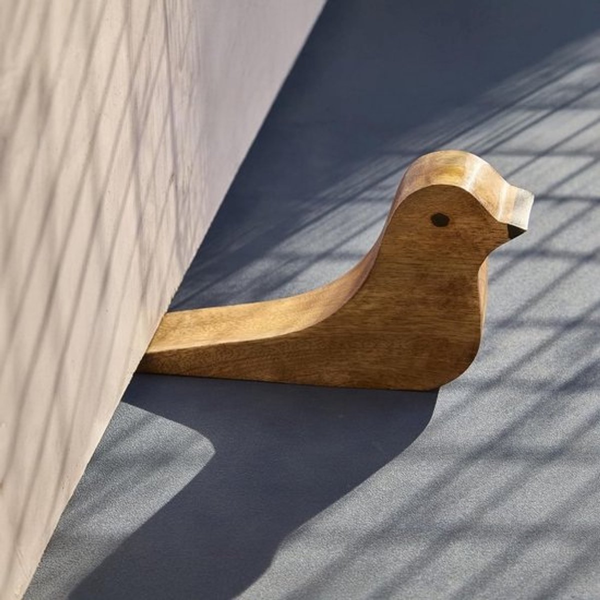 Houten deurstopper in de vorm van een vogel, gemaakt van mangohout