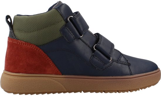 Baskets pour enfant bleu marine en cuir avec scratch, tissu vert et empiècements en daim rouge sur semelle marron.