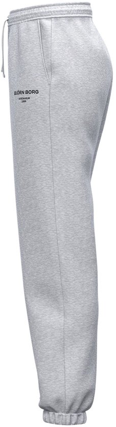 Lichtgrijze joggingbroek met trekkoord, elastische zoom en Björn Borg logo op linkerbeen. Zijaanzicht.