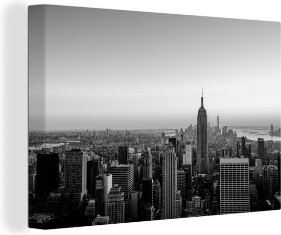 Canvas Schilderij Skyline van New York met een zonsondergang - zwart wit - Wanddecoratie