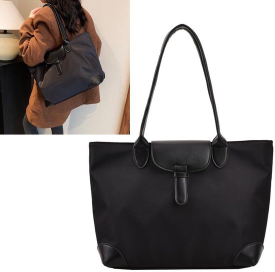 Zwarte nylon tote bag met leren details en hengsels, sluiting met klep en gesp.