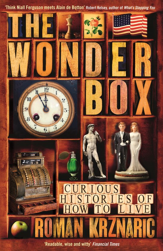 Boek kaft met de titel 'THE WONDER BOX' in houten letters, met een oude klok, kassa, flesje, beeldjes en appels.