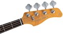 Houten kop van de basgitaar met vier stemmechanieken en "Marcus Miller V3" logo.