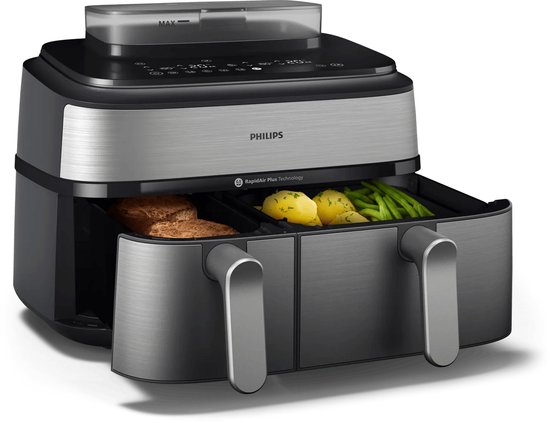 Philips heteluchtfriteuse met twee open lades, één met brood, de ander met aardappelen en sperziebonen.
