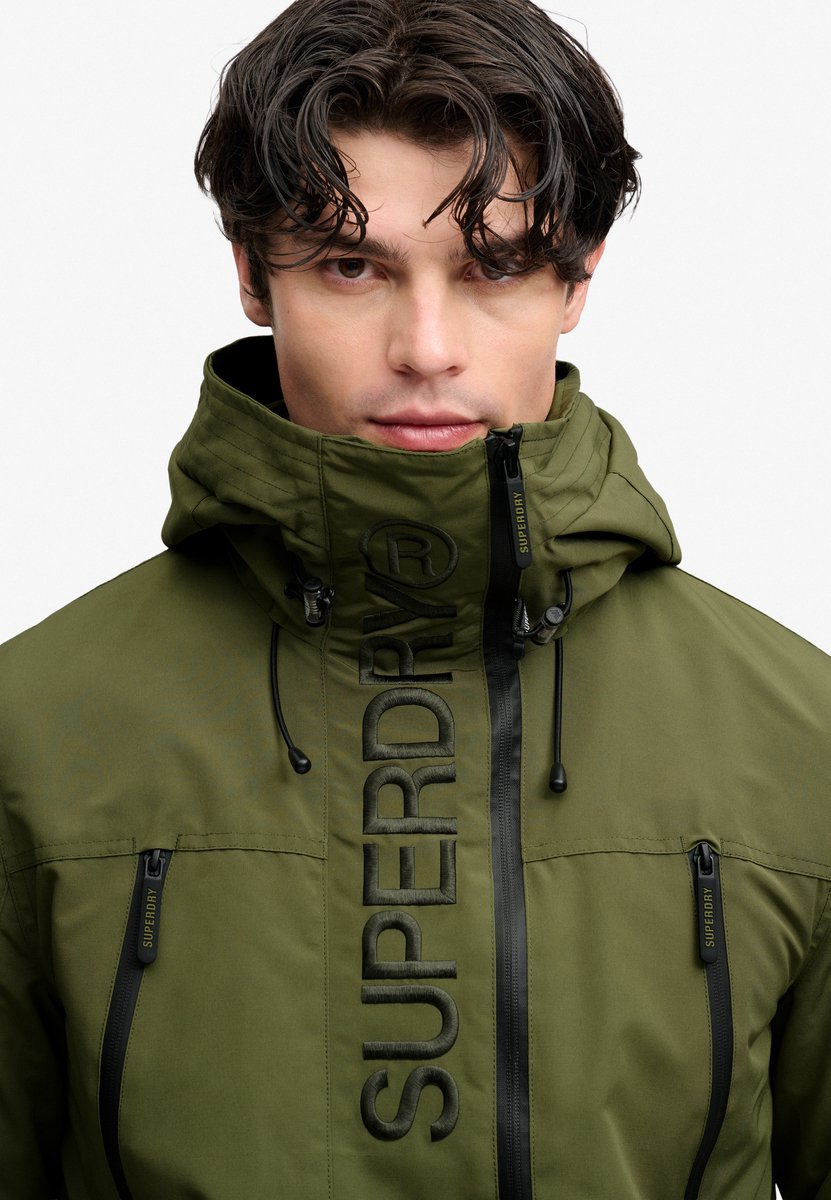 Superdry - Ultimate Geborduurd Windbreaker Jack met Capuchon - Heren