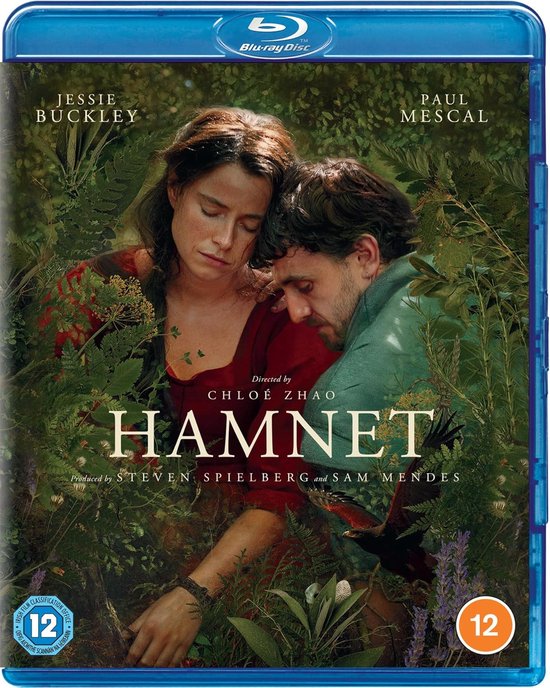 Jessie Buckley en Paul Mescal in een close-up, omringd door groen. Titel "HAMNET" centraal.