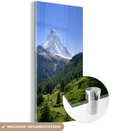 MuchoWow® Glasschilderij 80x160 cm - Schilderij acrylglas - Zwitserse Alpen in Matterhorn met groene bomen - Foto op glas - Schilderijen
